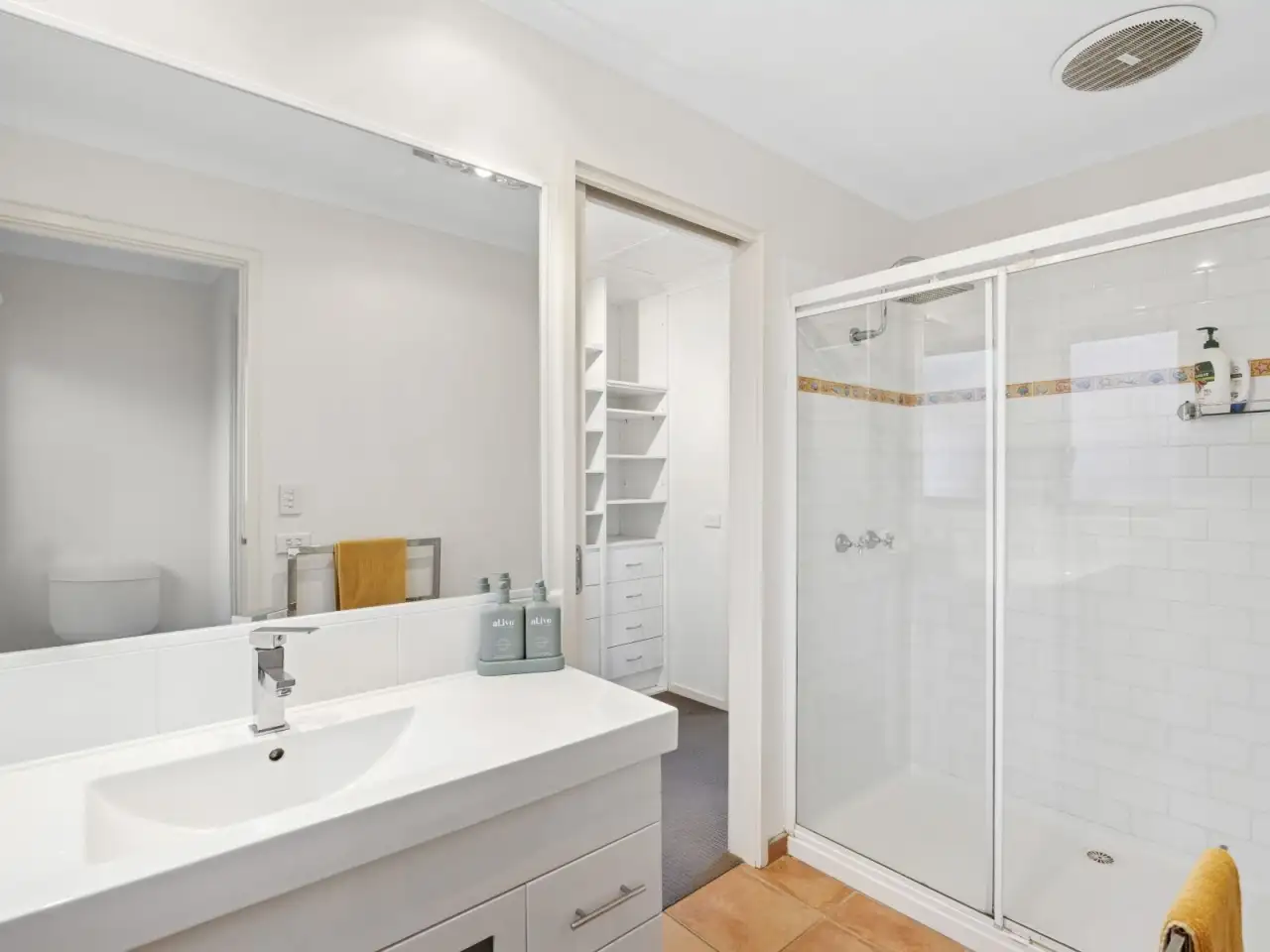 Bathroom with vanity and shower