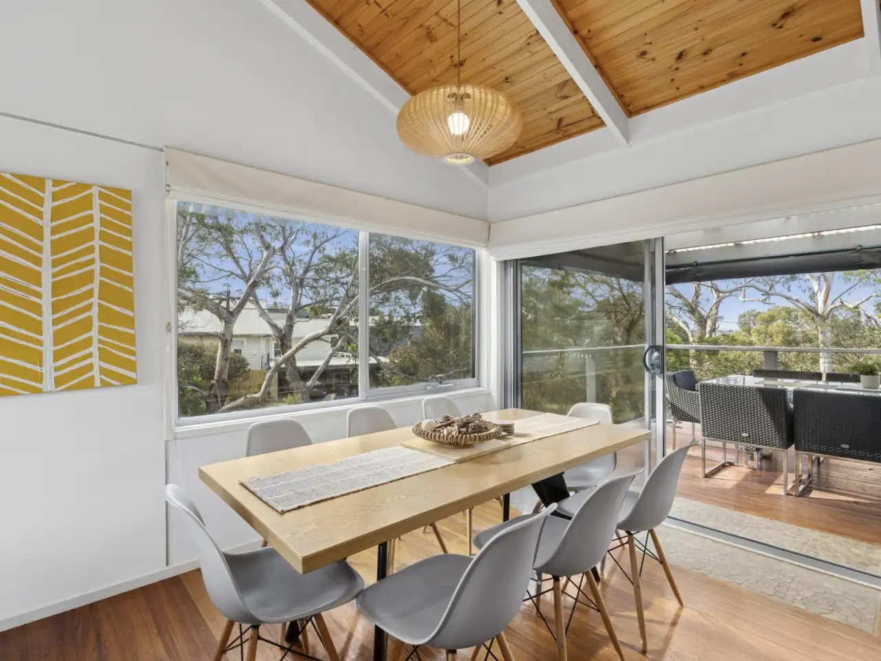 Dining table for eight beside the deck doors